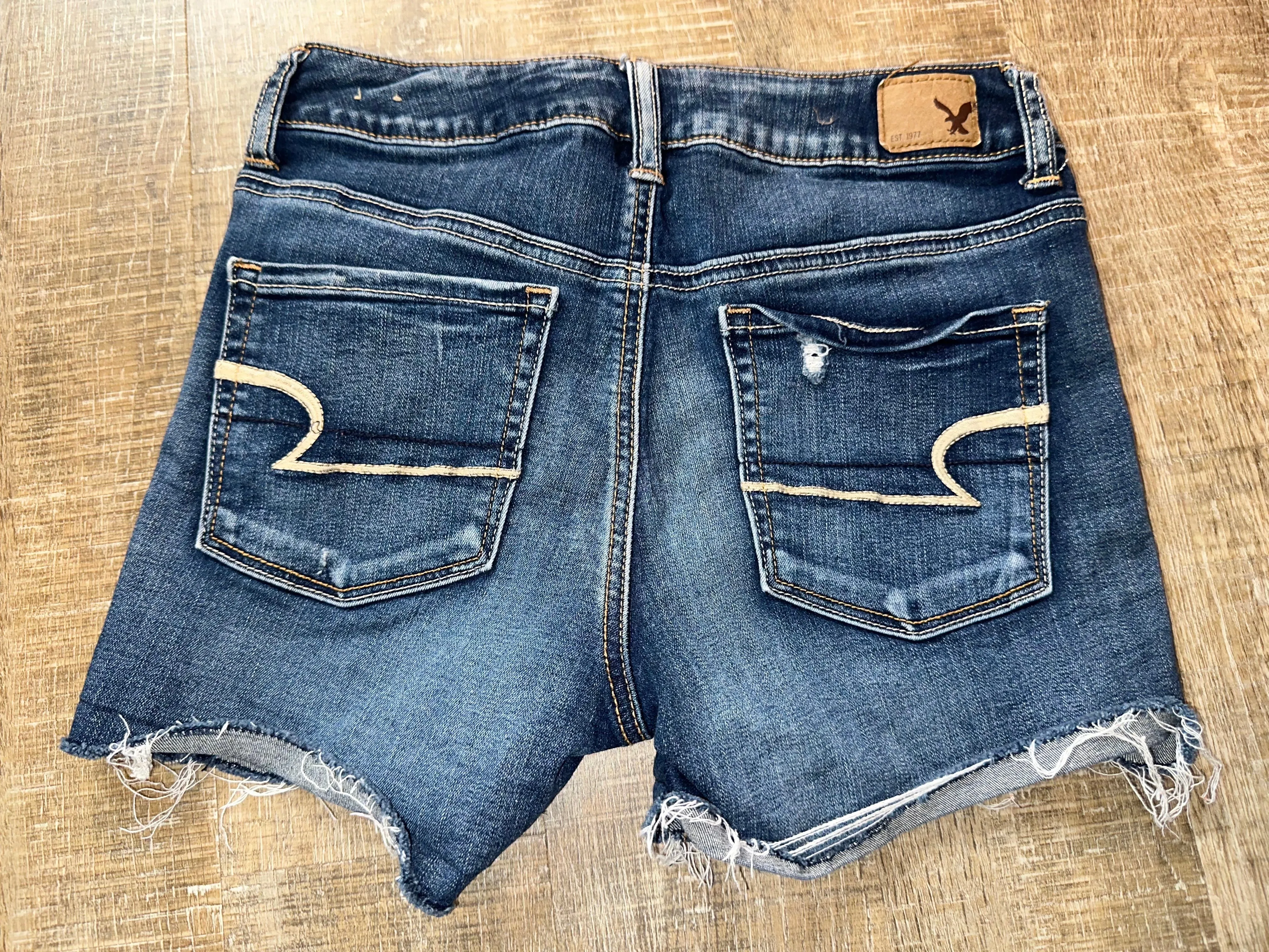 American Eagle (4) Distressed Denim Super Stretch Midi Jean Shorts