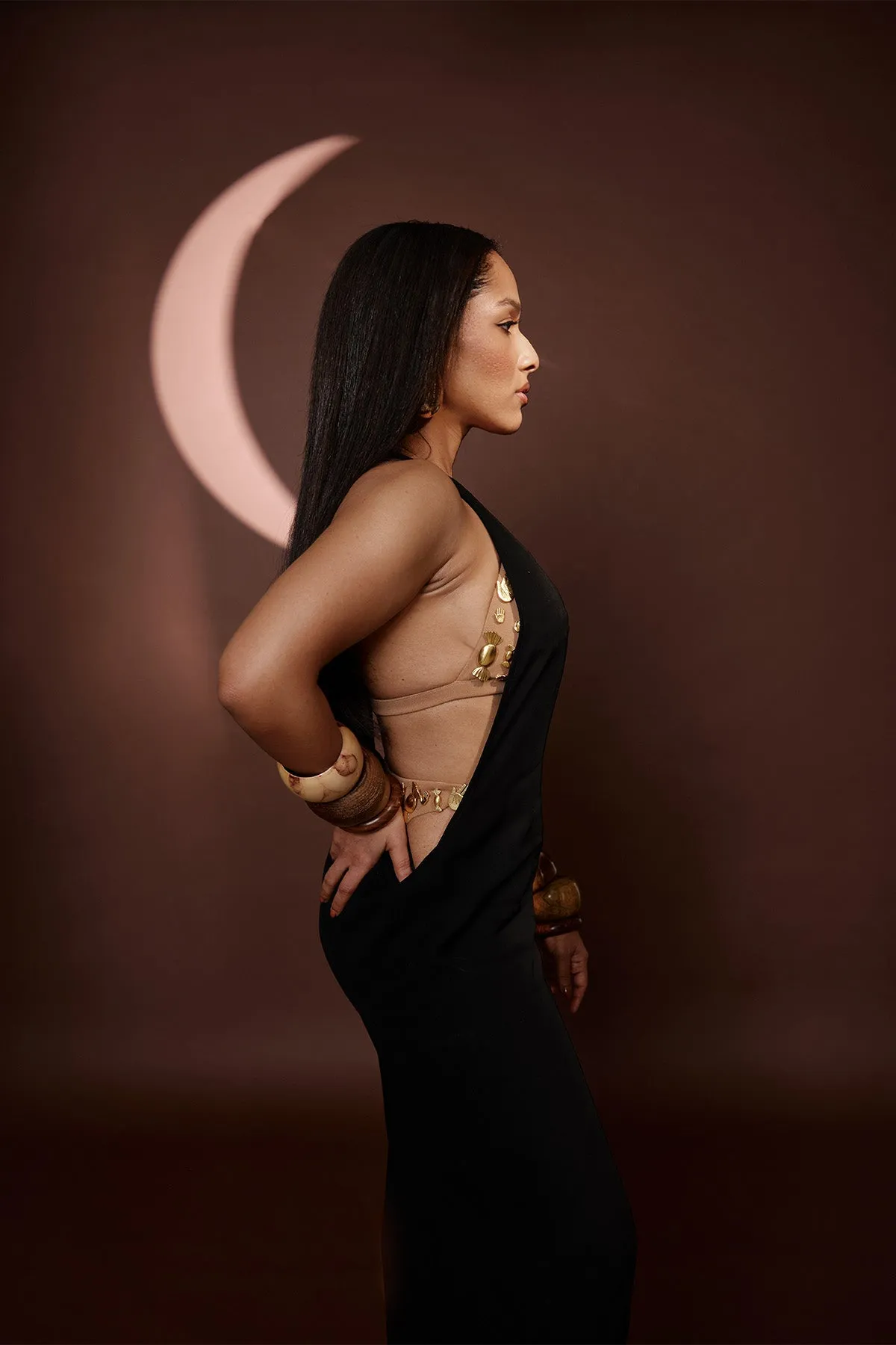 Black dress with ruby bra and whip