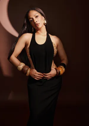 Black dress with ruby bra and whip