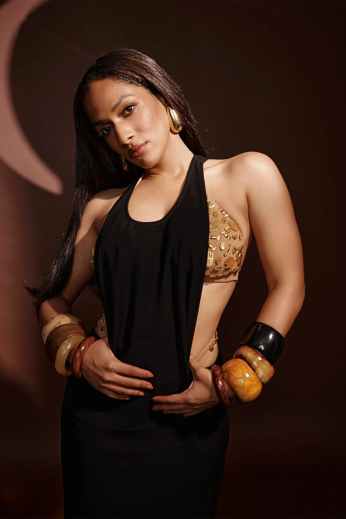 Black dress with ruby bra and whip