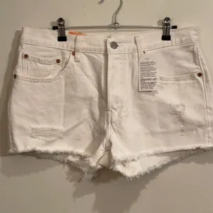 Levi’s Original Fit 501 Buttonfly White Distressed Jean Shorts