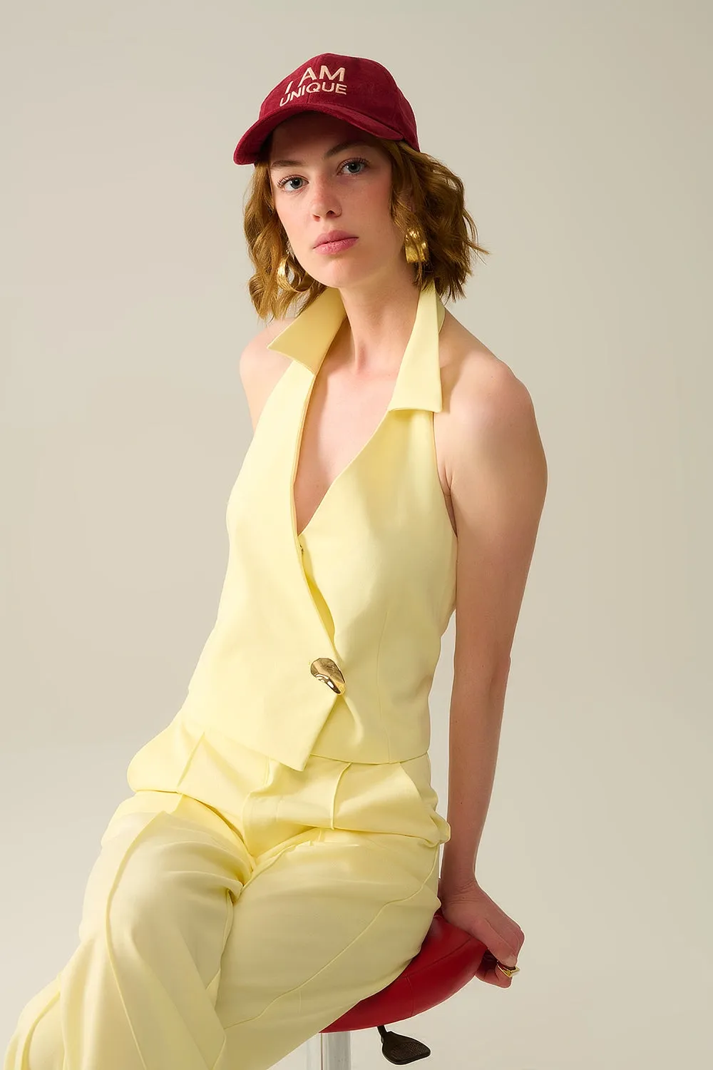 Yellow wrap vest with detailed gold button