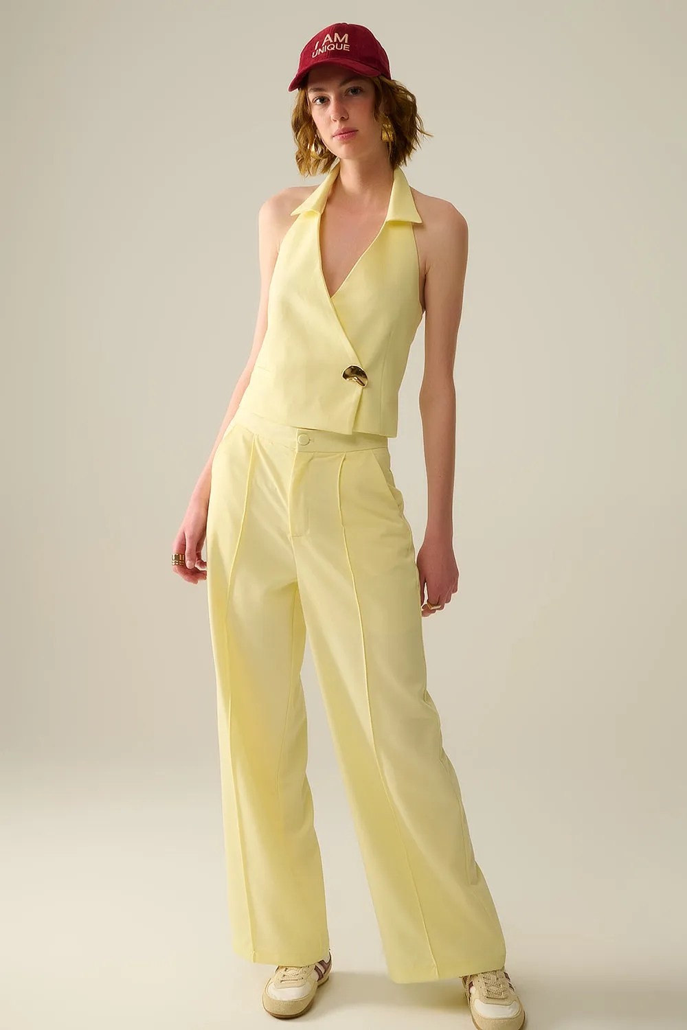 Yellow wrap vest with detailed gold button